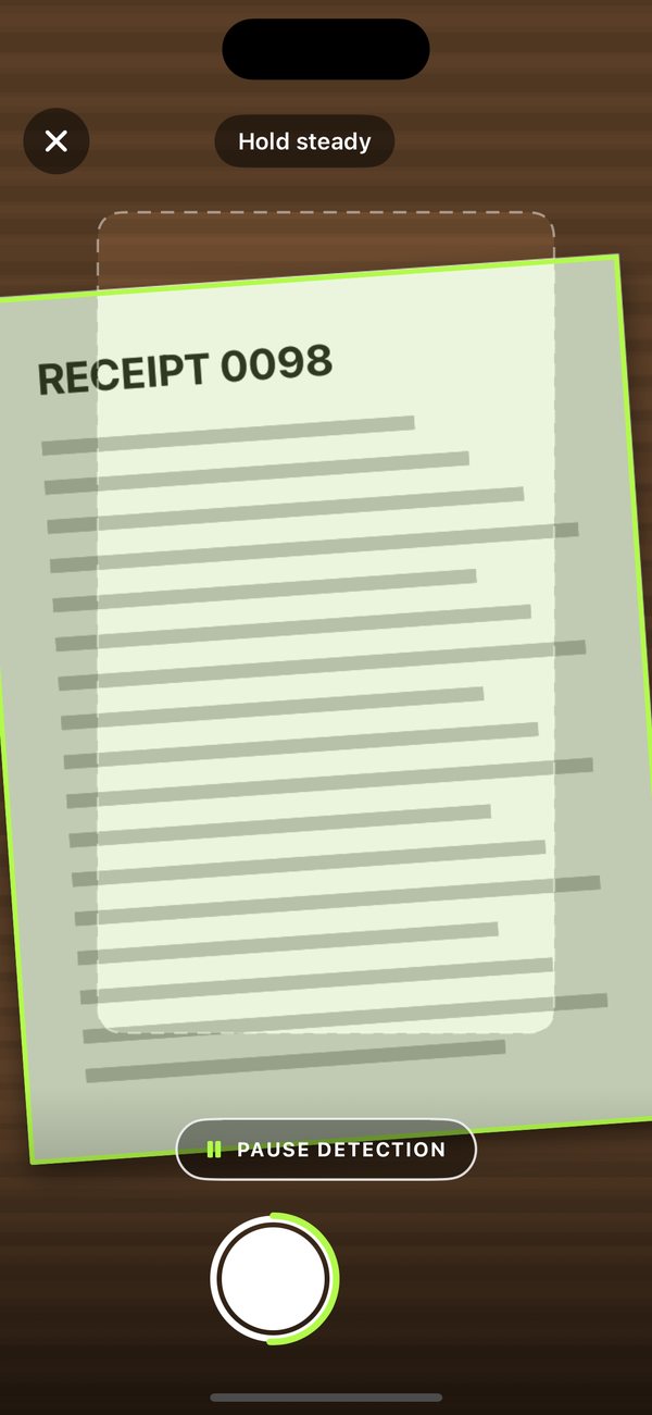 The camera outlining a page in lime while it holds still.